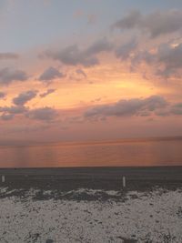 Scenic view of sea against sky at sunset