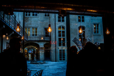 Illuminated buildings in city at night