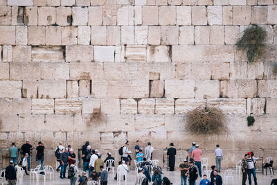 Group of people on wall