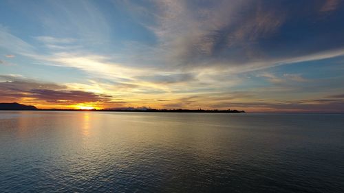 Scenic view of sea against dramatic sky