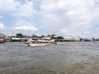 Scenic view of sea against sky in city