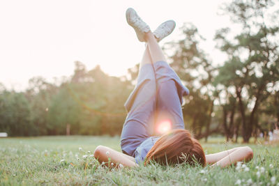 Woman lying on grass