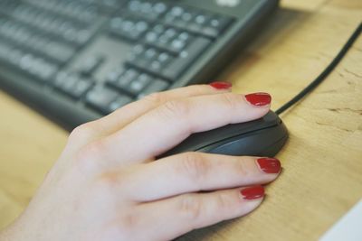 Midsection of woman using mobile phone