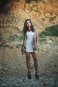 Portrait of young woman standing outdoors