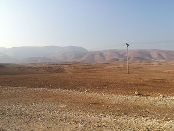 Scenic view of desert against clear sky