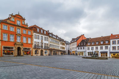 Residential buildings against sky in city