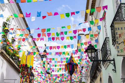 Low angle view of multi colored flags