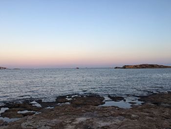 Scenic view of sea against clear sky