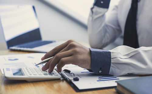 Close-up of businessman working in office