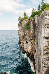 Scenic view of sea against cloudy sky