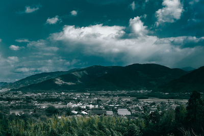 Cityscape with mountain range in background