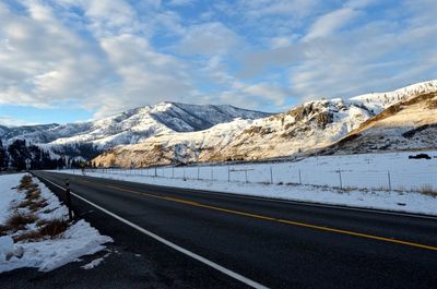 Scenic view of snow covered mountains against sky