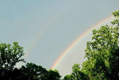 Low angle view of rainbow against sky