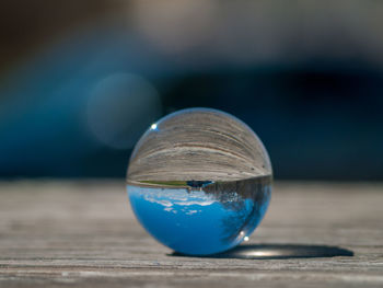 Close-up of crystal ball on table