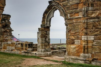 Old ruins of building against sky