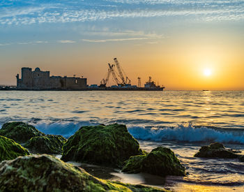 Scenic view of sea against sky during sunset