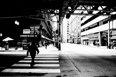 People walking on railroad station platform