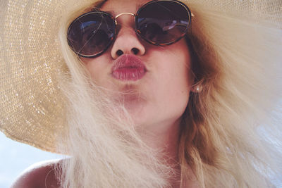 Close-up portrait of woman wearing sunglasses
