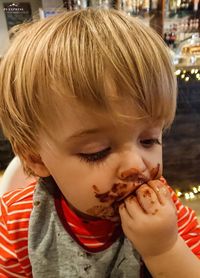 Portrait of cute boy eating food