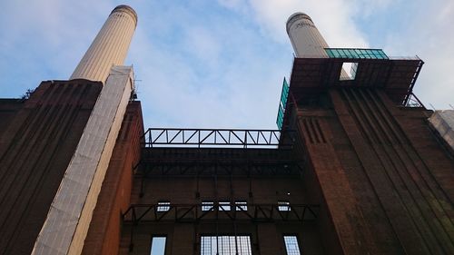 Low angle view of building against cloudy sky