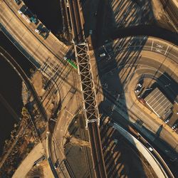 High angle view of railroad tracks by road in city