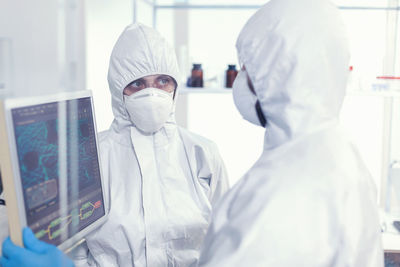 Portrait of female doctor standing in laboratory