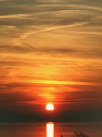 Scenic view of sea against orange sky