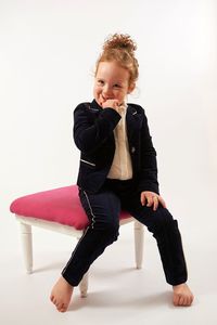 Young woman looking away over white background