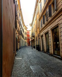 Road amidst buildings in city