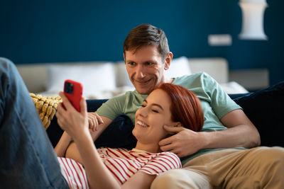 Portrait of young woman using mobile phone