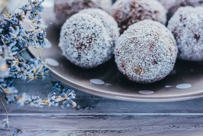 Close-up of coconut truffles in plate