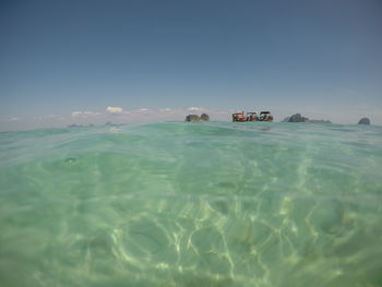 Scenic view of sea against clear blue sky