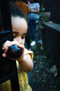 Portrait of boy holding girl