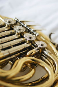 Close-up of brass instrument on table