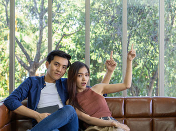 Young couple sitting in park