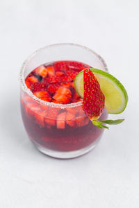 High angle view of strawberries on table against white background