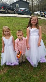 Portrait of happy girl sitting on table