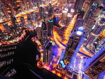 High angle view of illuminated buildings in city at night