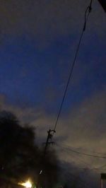 Low angle view of electricity pylon against sky