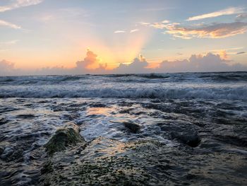 Scenic view of sea against sky during sunset