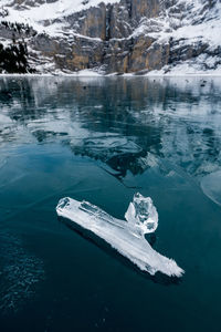 Scenic view of frozen sea against mountain