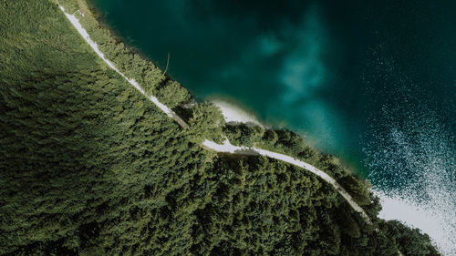 High angle view of land and sea against sky