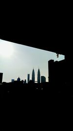 Silhouette of church against sky