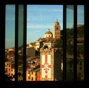 View of cityscape seen through window