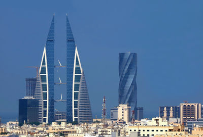 Amazing manama skyline with the iconic bahrain building and the united tower, manama city, bahrain