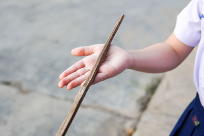 Close-up of hand holding finger