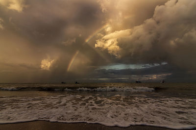 Scenic view of sea against dramatic sky