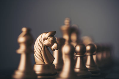 Close-up of chess against gray background