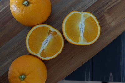 Close-up of orange fruits on cutting board