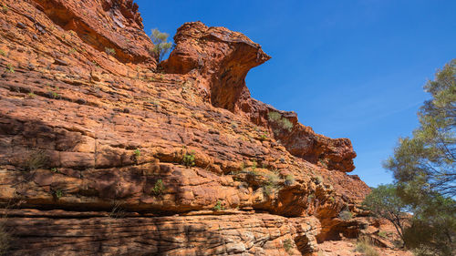Low angle view of rock formations against sky